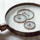 Magnifying glass over watch icon